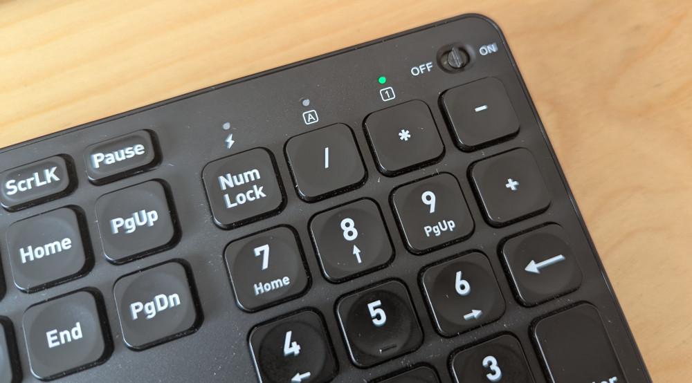 Closeup of keyboard with missing additional keys above the number pad